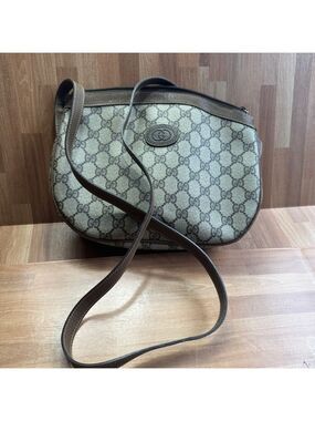 vintage Gucci GG Supreme canvas and brown leather crossbody shoulder bag.